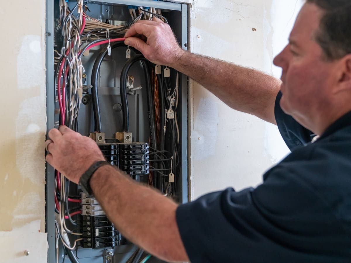 electrician performing an electrical panel upgrade