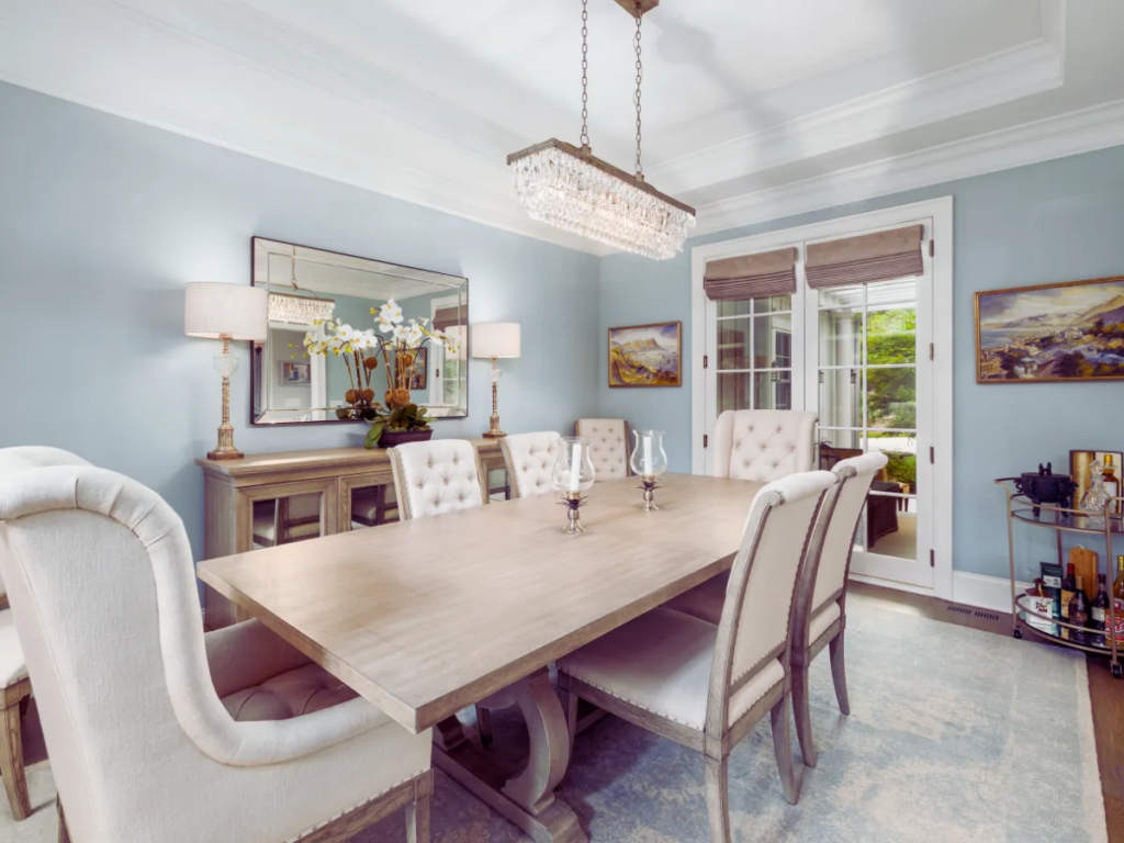 chandelier hanging above dinner table in dining room