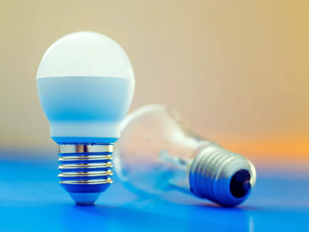 LED light bulb next to standard light bulb