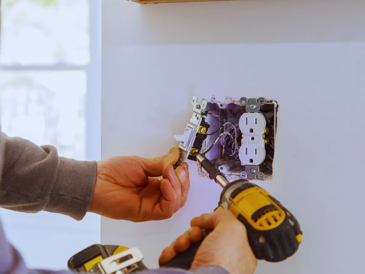 Electrician performing outlet replacement for home in Chicago, IL