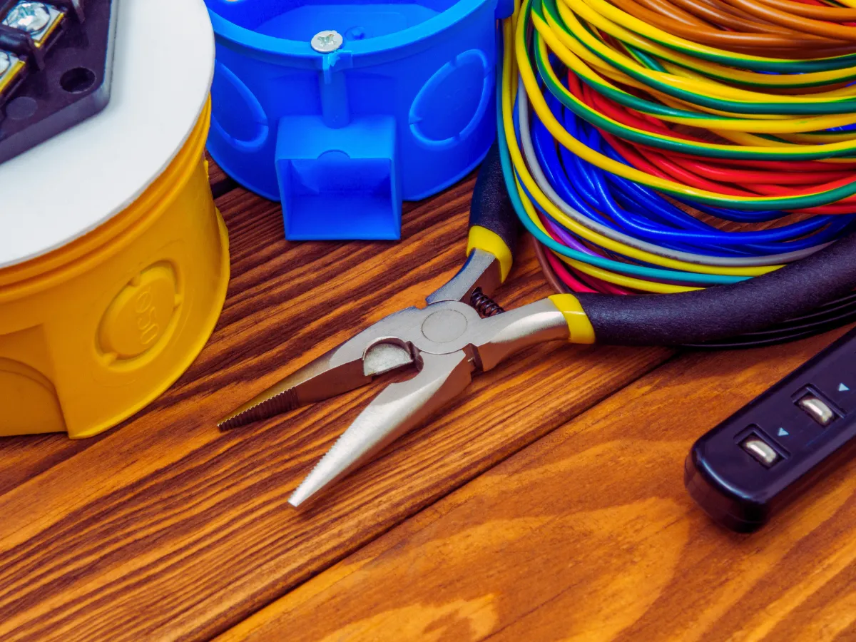 various electrical tools and wiring on table