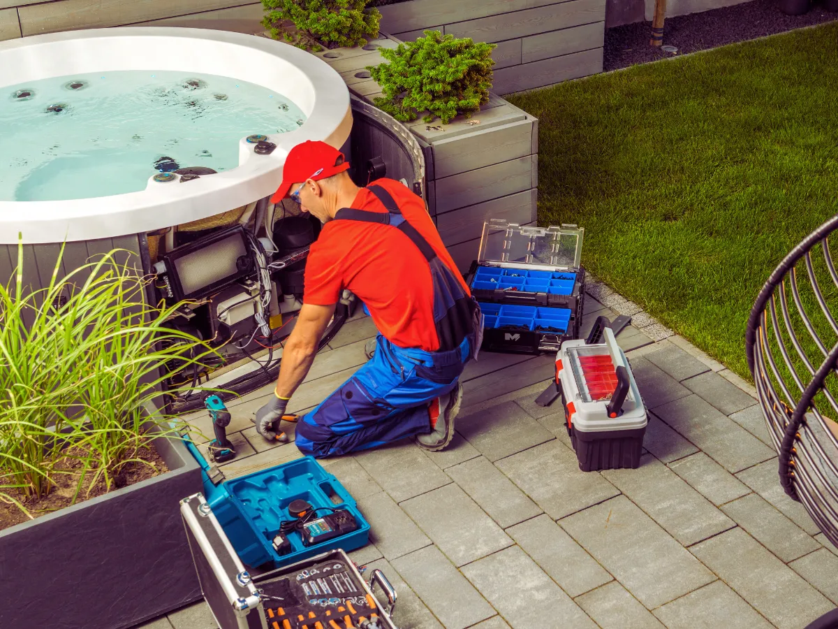 electrician performing hot tub wiring for small hot tub