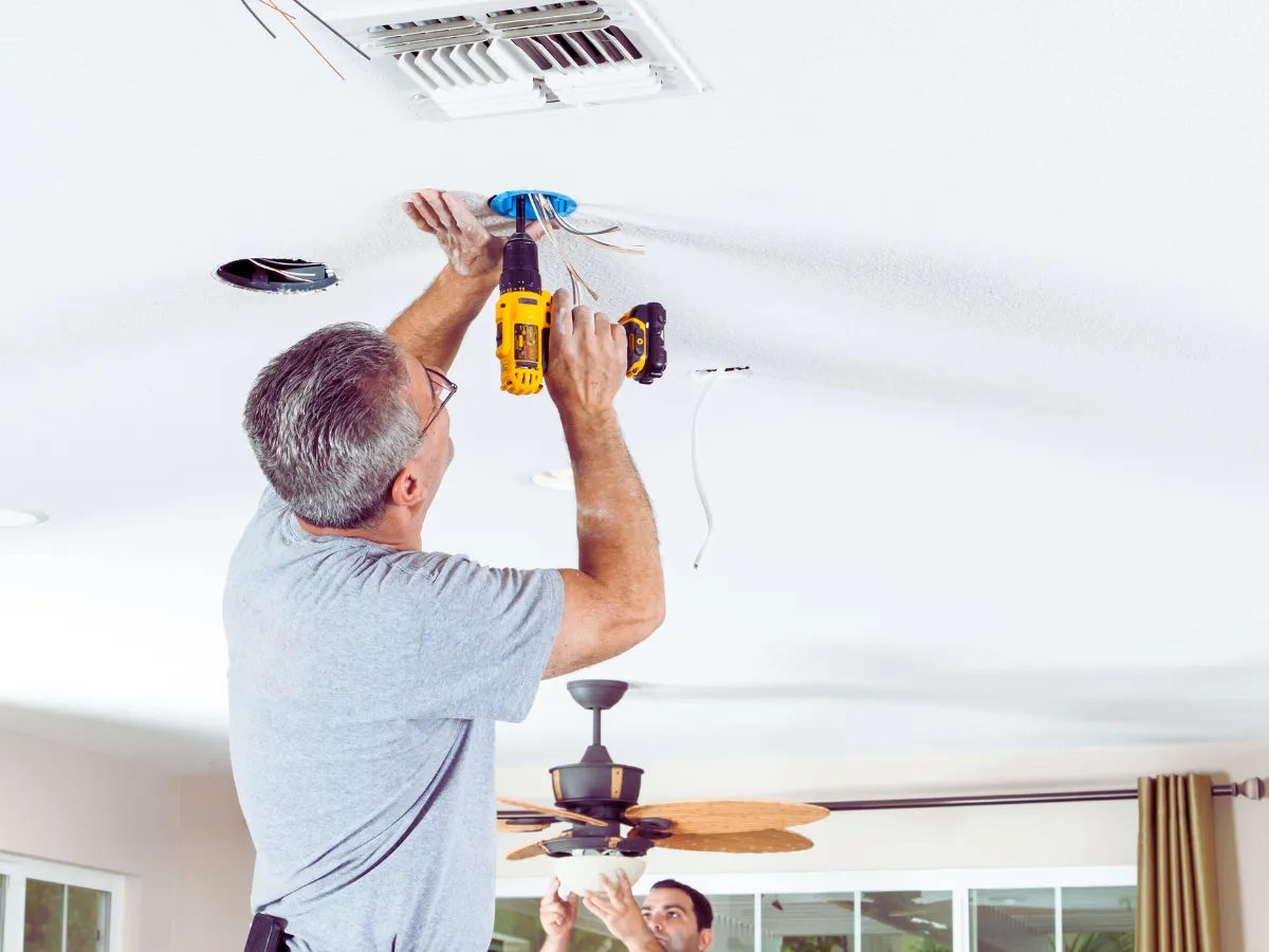 electricians performing light installation in Chicago home