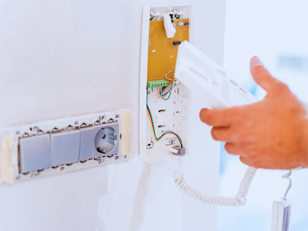electrician installing intercom system