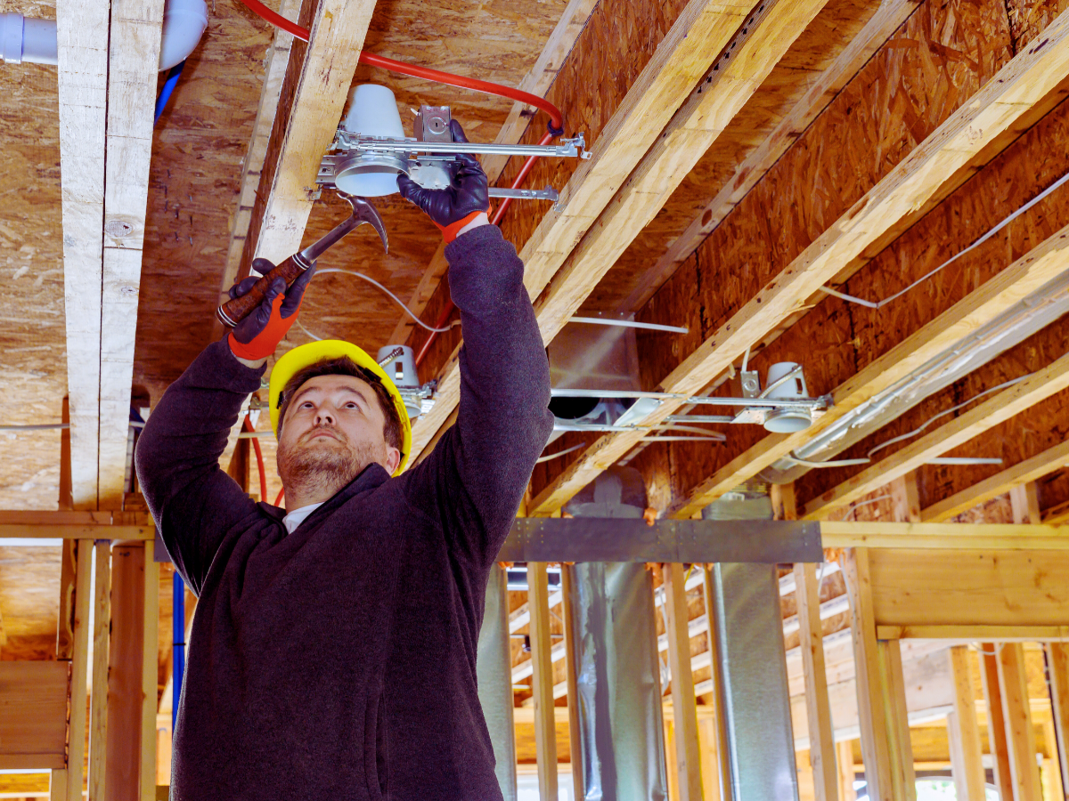 electrician performing recessed lighting installation